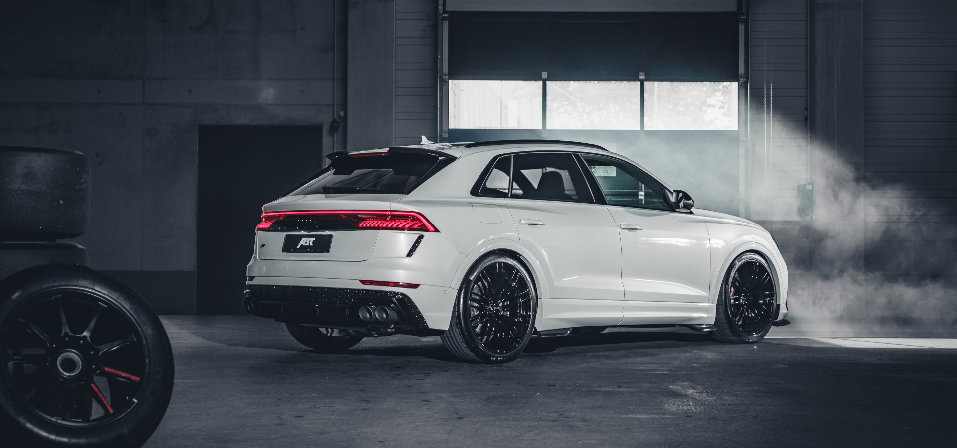 White RSQ8-S from the side rear view in a hall