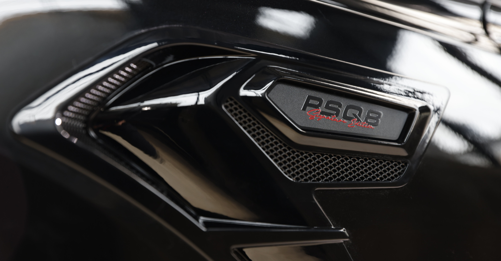 Close-up of wheel arch ventilation logo