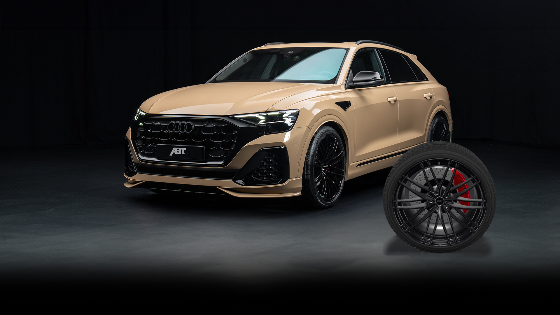 Golden Q8 from the side front view in black space with free-standing rim in the foreground